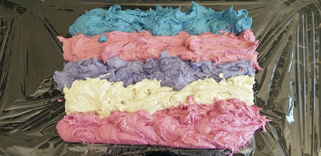 Buttercream lined up in cling film