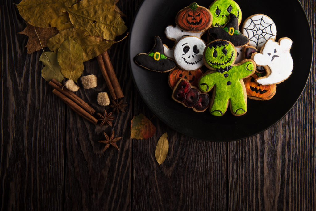 Homemade delicious ginger biscuits for Halloween on wooden table