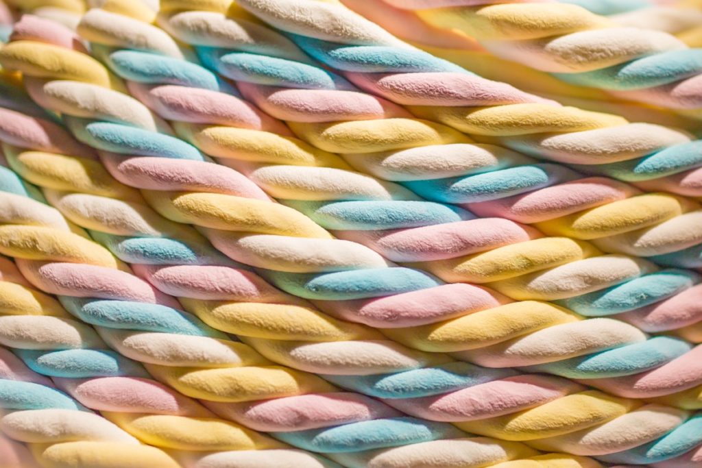 Rows of pastel coloured marshmallow ropes